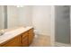 Bright bathroom with double sinks, and a glass door shower at 15555 E 40Th Ave # 36, Denver, CO 80239