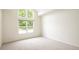Bright bedroom features a large window allowing natural light to illuminate the room at 15555 E 40Th Ave # 36, Denver, CO 80239