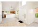 Open concept entryway with views to the kitchen in an open floor plan at 15555 E 40Th Ave # 36, Denver, CO 80239