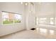 Bright entryway with soaring ceilings and views of the lake in an open floor plan at 15555 E 40Th Ave # 36, Denver, CO 80239
