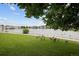 Scenic view of a tranquil pond surrounded by lush greenery and charming homes, creating a serene atmosphere at 15555 E 40Th Ave # 36, Denver, CO 80239