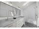 Bright primary bathroom with double vanity, lots of natural light, and stand up shower at 3303 Wolfensberger Rd, Sedalia, CO 80135