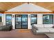 Inviting covered patio with wooden ceiling, comfortable seating and stunning views at 3303 Wolfensberger Rd, Sedalia, CO 80135