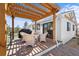 Outdoor deck with pergola and seating area at 3303 Wolfensberger Rd, Sedalia, CO 80135