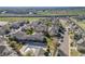 Community aerial view featuring townhomes, green spaces, pool, and street parking at 13025 Grant Cir # A, Thornton, CO 80241