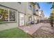 Cozy back patio area featuring a small table with chairs and a well-maintained gravel and stone landscape at 13025 Grant Cir # A, Thornton, CO 80241