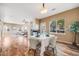 Bright dining area features hardwood floors, a fireplace, and ample natural light at 13025 Grant Cir # A, Thornton, CO 80241