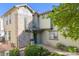 Charming exterior view featuring unique stone accents, well-maintained landscaping, and a welcoming entrance at 13025 Grant Cir # A, Thornton, CO 80241