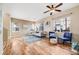 Spacious living room features hardwood floors, natural light, and modern decor at 13025 Grant Cir # A, Thornton, CO 80241