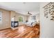Spacious main bedroom suite with cozy fireplace, large window, hardwood floors, and decorative touches at 13025 Grant Cir # A, Thornton, CO 80241