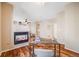 View of a main bedroom that includes a fireplace, ceiling fan, ensuite bathroom and hardwood floors at 13025 Grant Cir # A, Thornton, CO 80241