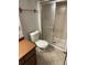 Bathroom with shower over tub, toilet and wooden vanity at 3923 S Idalia St, Aurora, CO 80013