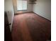 Bedroom featuring a window with blinds, shelves, and carpeted floors at 3923 S Idalia St, Aurora, CO 80013