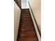 Stairway features dark wood steps and railing at 3923 S Idalia St, Aurora, CO 80013