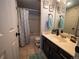 Bathroom with tub, shower, and dark vanity at 11105 E Alameda Ave # 202, Aurora, CO 80012