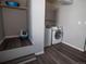 Laundry room with washer, dryer, and shelving at 11105 E Alameda Ave # 202, Aurora, CO 80012