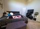 Main bedroom with large window and plush carpeting at 11105 E Alameda Ave # 202, Aurora, CO 80012