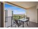 Balcony featuring a table and chairs with a view of city buildings and the skyline at 300 W 11Th Ave # 15C, Denver, CO 80204