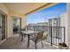Charming balcony featuring a table and chairs with a lovely cityscape view at 300 W 11Th Ave # 15C, Denver, CO 80204