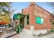 Attractive brick commercial building, Cherokee Row, with green trim, and now open signage at 300 W 11Th Ave # 15C, Denver, CO 80204