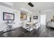 Modern dining area with hardwood floors, open floor plan, stylish lighting, and easy access to kitchen at 300 W 11Th Ave # 15C, Denver, CO 80204