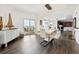 Bright and spacious dining area features hardwood floors, modern light fixture, and balcony access at 300 W 11Th Ave # 15C, Denver, CO 80204