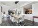 Open concept living space with modern dining area and hardwood floors at 300 W 11Th Ave # 15C, Denver, CO 80204