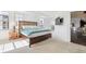 Bright main bedroom with large windows, plush carpeting, access to a balcony, and ensuite access at 300 W 11Th Ave # 15C, Denver, CO 80204