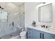 Elegant bathroom featuring a glass-enclosed shower, a vanity with modern fixtures, and stylish tile work at 2900 S Adams St, Denver, CO 80210