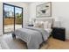 Bright bedroom with a large window, comfortable bed, and modern decor at 2900 S Adams St, Denver, CO 80210