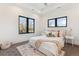 Bright bedroom featuring a plush bed, stylish decor, and well-lit space perfect for relaxing and unwinding at 2900 S Adams St, Denver, CO 80210
