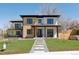 Stunning two-story home with a welcoming walkway and lush green lawn enhancing its curb appeal at 2900 S Adams St, Denver, CO 80210