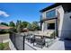 Outdoor living space featuring modern patio furniture and a black metal railing at 2900 S Adams St, Denver, CO 80210