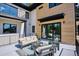 Outdoor patio with stylish furniture and a view of the landscaped yard at 2900 S Adams St, Denver, CO 80210