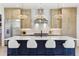 Bright kitchen with island seating, modern cabinets, stainless steel appliances, and stylish pendant lights at 2900 S Adams St, Denver, CO 80210