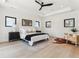 Serene main bedroom with a ceiling fan, multiple windows, and tasteful decor at 2900 S Adams St, Denver, CO 80210