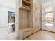Well-organized mudroom with custom wooden cabinets, bench seating, and ample storage space at 2900 S Adams St, Denver, CO 80210