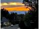 Serene street view home featuring stunning mountain and sunset views, complete with a well-maintained lawn at 2900 S Adams St, Denver, CO 80210