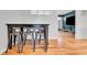 Cozy dining area with modern table and seating, adjacent to the living room and an open kitchen area at 4680 Independence St, Wheat Ridge, CO 80033