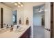 Bathroom featuring decorative tile, a sink, and a large mirror at 3174 Soaring Eagle Ln, Castle Rock, CO 80109