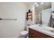 Cozy bathroom with a charming wooden shelf and ample lighting for a warm and inviting space at 3174 Soaring Eagle Ln, Castle Rock, CO 80109