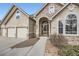 Inviting entrance with stone accents and a well-manicured garden path, located at 3174 at 3174 Soaring Eagle Ln, Castle Rock, CO 80109