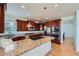 Gourmet kitchen with a large island, granite counters, stainless steel appliances, and custom cabinetry at 3174 Soaring Eagle Ln, Castle Rock, CO 80109