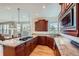 Spacious kitchen featuring granite countertops, a gas cooktop, and cherry wood cabinets at 3174 Soaring Eagle Ln, Castle Rock, CO 80109