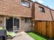 Private back patio with low maintenance turf and a sliding glass door at 12993 W 20Th Ave, Golden, CO 80401