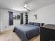 Bright bedroom featuring a ceiling fan, carpet, and mountain views from the window at 12993 W 20Th Ave, Golden, CO 80401