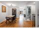 Hardwood dining room features modern light fixture and vintage display cabinet at 12993 W 20Th Ave, Golden, CO 80401