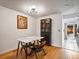 Dining room with hardwood floors, marble table, display case and art at 12993 W 20Th Ave, Golden, CO 80401