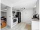 Bright kitchen featuring tile floors, stainless steel appliances, and a view to the living area at 12993 W 20Th Ave, Golden, CO 80401