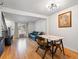 Cozy living area with hardwood floors, a leather couch and large windows at 12993 W 20Th Ave, Golden, CO 80401